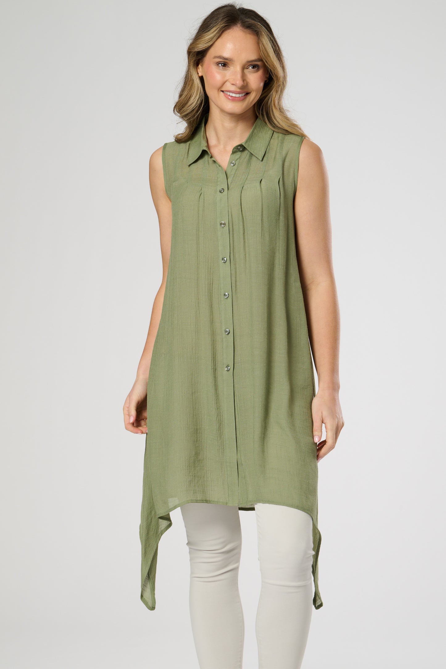 Sleeveless shirt style tunic with side dip hemline