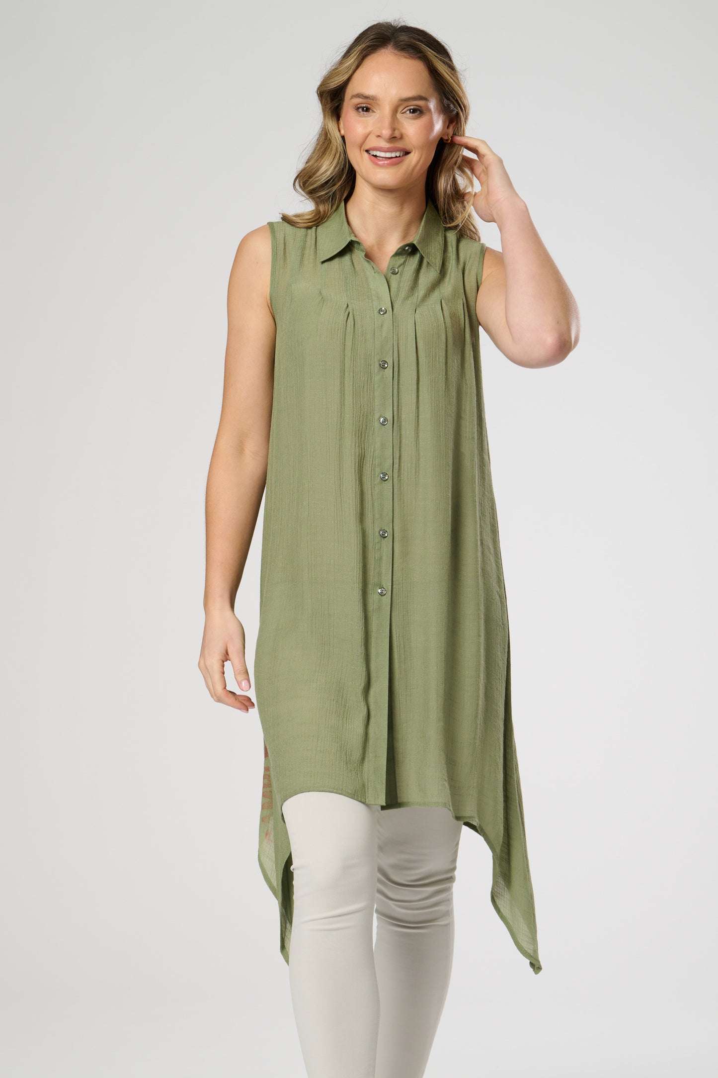 Sleeveless shirt style tunic with side dip hemline