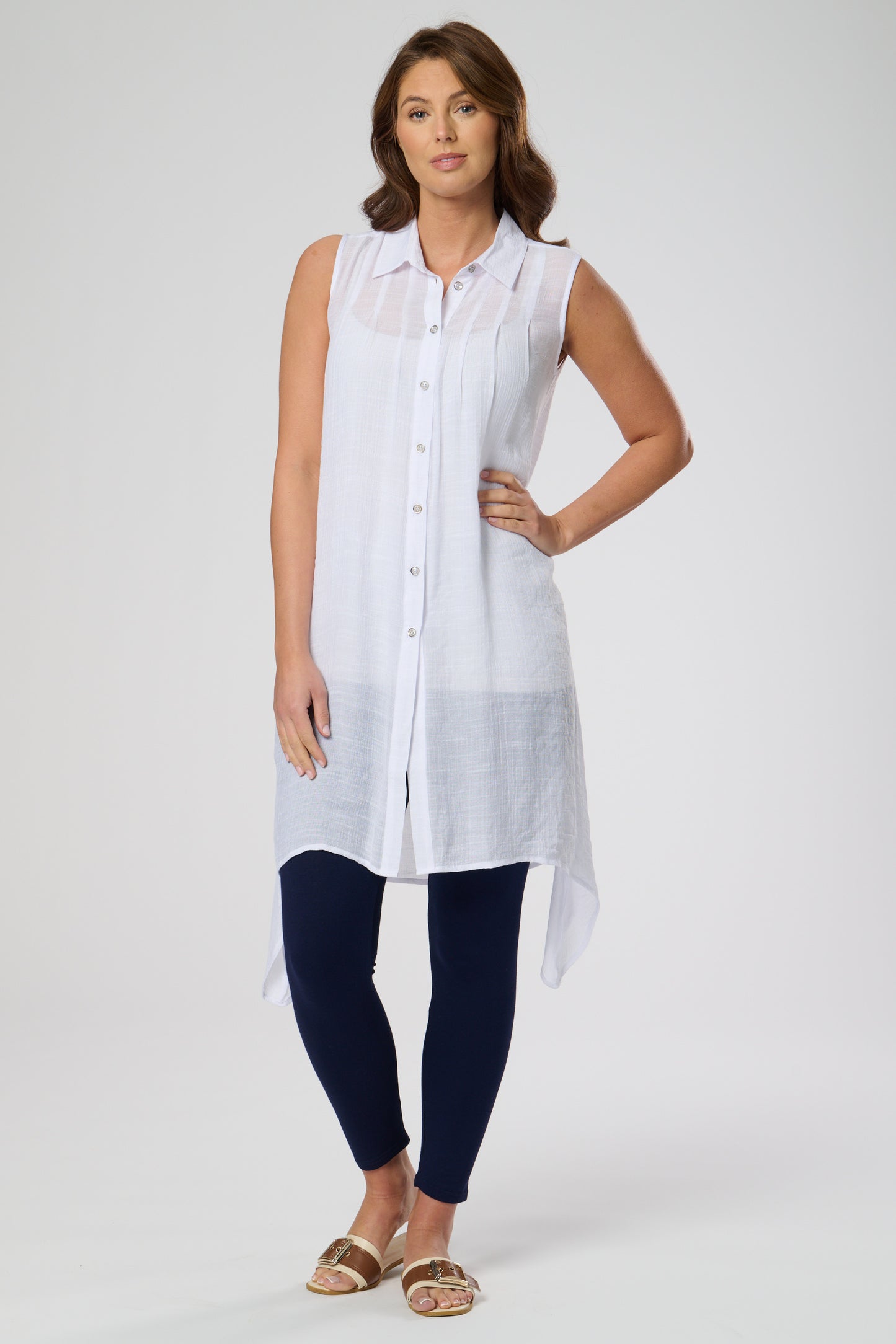 Sleeveless shirt style tunic with side dip hemline